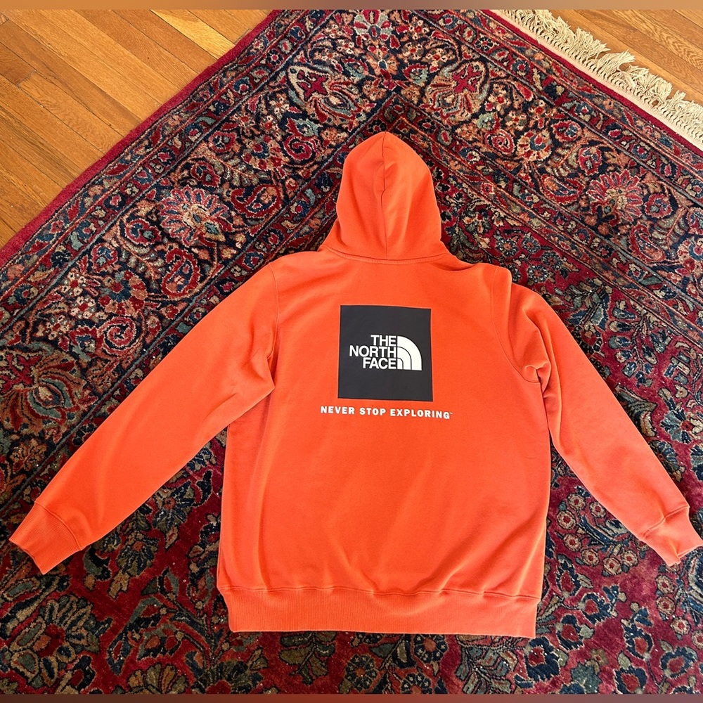 The North Face “Never Stop Exploring” hoodie sweatshirt